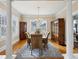 Elegant dining room with hardwood floors, chandelier, and large windows at 2120 Mckinley Nw Rd, Atlanta, GA 30318