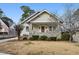 Charming bungalow with stone accents, covered porch, and manicured front lawn at 2120 Mckinley Nw Rd, Atlanta, GA 30318