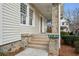 Inviting front porch with stone pillars, tiled steps, and a view of the home's entrance at 2120 Mckinley Nw Rd, Atlanta, GA 30318