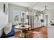 Bright eat-in kitchen featuring custom bench seating, stainless steel appliances, and white cabinetry at 2120 Mckinley Nw Rd, Atlanta, GA 30318