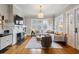 Bright and airy living room with a fireplace, hardwood floors, and a comfortable seating area at 2120 Mckinley Nw Rd, Atlanta, GA 30318