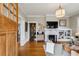 Cozy living room featuring hardwood floors, fireplace, built-in shelving, and abundant natural light at 2120 Mckinley Nw Rd, Atlanta, GA 30318