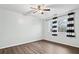 Bedroom featuring a ceiling fan, hardwood floors, and a window with striped curtains at 3524 Pine Grove Drive, Douglasville, GA 30135