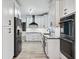 Renovated kitchen features updated countertops, stainless steel appliances, and white cabinetry at 3524 Pine Grove Drive, Douglasville, GA 30135