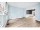 Living room with hardwood floors, neutral paint, and a bright window at 3524 Pine Grove Drive, Douglasville, GA 30135