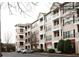 Exterior view of the property showcasing multiple floors, balconies, and parking at 4333 Dunwoody Park # 2104, Dunwoody, GA 30338