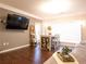 Open-concept living area featuring dark floors, dining area and abundant natural light at 4333 Dunwoody Park # 2104, Dunwoody, GA 30338