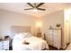 Cozy bedroom with a neutral palette, a ceiling fan and a bedside table with drawers for storage at 4333 Dunwoody Park # 2104, Dunwoody, GA 30338