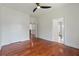 Bedroom featuring multiple doors and hardwood flooring at 4566 Town Manor Dr, Douglasville, GA 30135