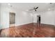 Bright bedroom with dark hardwood floors, white walls and ceiling fan at 4566 Town Manor Dr, Douglasville, GA 30135