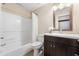 Bathroom featuring a shower/tub combo and a dark wood vanity at 938 Canterbury Ln, Atlanta, GA 30324