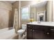 Bathroom featuring a shower/tub combo and vanity with ample storage at 938 Canterbury Ln, Atlanta, GA 30324