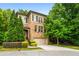 Charming brick home with a two-car garage, beautiful landscaping, and inviting front entrance at 938 Canterbury Ln, Atlanta, GA 30324