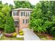 Charming brick home with a two-car garage, beautiful landscaping, and inviting front entrance at 938 Canterbury Ln, Atlanta, GA 30324