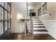 Inviting foyer with hardwood floors, staircase, and natural light coming in from the entry door at 938 Canterbury Ln, Atlanta, GA 30324