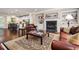 Bright living room featuring a fireplace, built-in bookshelves, and an open layout with hardwood floors at 938 Canterbury Ln, Atlanta, GA 30324