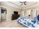 Bedroom view with a flat screen tv, walk-in closet and tray ceiling at 938 Canterbury Ln, Atlanta, GA 30324