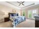 Spacious bedroom featuring a king bed with a floral comforter and outdoor access at 938 Canterbury Ln, Atlanta, GA 30324