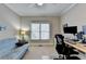 Bright office featuring a futon, natural light from the window, and a ceiling fan at 1683 Wheatstone Dr, Grayson, GA 30017