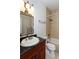 Elegant bathroom features an ornate mirror, tiled shower and bath with stylish fixtures at 259 14Th Ne St # 104, Atlanta, GA 30309