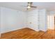 Bedroom featuring hardwood floors, large closet, ceiling fan and open shelving at 259 14Th Ne St # 104, Atlanta, GA 30309