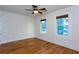 Bright bedroom features hardwood floors, ceiling fan, and natural light from windows at 259 14Th Ne St # 104, Atlanta, GA 30309