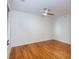 Bedroom featuring hardwood floors, a ceiling fan, and bright windows with blinds at 259 14Th Ne St # 104, Atlanta, GA 30309
