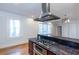 Open kitchen featuring stainless steel appliances, granite counters, and hardwood flooring at 259 14Th Ne St # 104, Atlanta, GA 30309