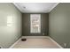 A clean and well-lit bedroom with neutral carpet and a window at 2956 Silver Hill Se Ter, Atlanta, GA 30316