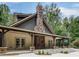 A covered outdoor common area with stone and wood construction details at 6792 Hunters Trace Cir, Atlanta, GA 30328