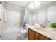 Clean bathroom featuring a tub and shower combination and a wood vanity with ample mirror space at 1219 Waterville Ct, Alpharetta, GA 30022