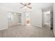 Bright bedroom featuring neutral tones, carpeted floor, ceiling fan and closet with mirrored doors at 1219 Waterville Ct, Alpharetta, GA 30022