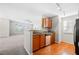 Open kitchen featuring modern countertops, stainless steel appliances and hardwood floors at 1219 Waterville Ct, Alpharetta, GA 30022