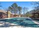 Community pool featuring a covered building, mature trees and pool with cover at 1219 Waterville Ct, Alpharetta, GA 30022