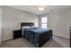 Cozy bedroom with a ceiling fan and neutral walls at 1348 Rolling Stream Way, Lawrenceville, GA 30043