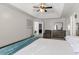 Bedroom with tray ceiling, neutral walls and walk-in closet at 1348 Rolling Stream Way, Lawrenceville, GA 30043