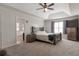 Bedroom with neutral decor, plush carpet, and ample natural light at 1348 Rolling Stream Way, Lawrenceville, GA 30043