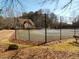 Community tennis court with fence at 1348 Rolling Stream Way, Lawrenceville, GA 30043