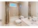 Neutral toned bathroom featuring a vanity with a white sink and a shower-tub combination with shower curtain at 1510 Mount Mckinley Dr, Grayson, GA 30017