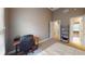 Bedroom featuring a desk and a small decorative shelf with a soft white comforter on the bed at 1510 Mount Mckinley Dr, Grayson, GA 30017