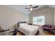 Bright bedroom with a vaulted ceiling, fan, and a comfortable chair at 1510 Mount Mckinley Dr, Grayson, GA 30017