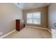 Bedroom with natural lighting, including a four drawer dresser at 1510 Mount Mckinley Dr, Grayson, GA 30017