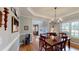 Bright dining area with hardwood floors, large windows, and modern lighting fixtures at 1510 Mount Mckinley Dr, Grayson, GA 30017