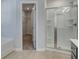 Bathroom featuring glass shower, tub and open door to carpeted walk-in closet with wire shelving at 305 Heavenly Hollow Pl, Mcdonough, GA 30253