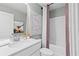 Well-lit bathroom with vanity, modern faucet, shower and tub combination, and decorative artwork at 305 Heavenly Hollow Pl, Mcdonough, GA 30253