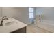 Bathroom with double sink vanity, granite counters, and tiled floor at 305 Heavenly Hollow Pl, Mcdonough, GA 30253