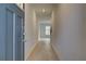 Inviting hallway features sleek floors, neutral walls, and a clear view into the home's interior at 305 Heavenly Hollow Pl, Mcdonough, GA 30253