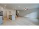 Open-concept living room featuring wood floors, recessed lighting, and a staircase at 305 Heavenly Hollow Pl, Mcdonough, GA 30253