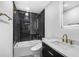 Contemporary bathroom with black subway tile, glass shower door, and modern vanity with stylish gold fixtures and space at 3661 W Potomac Dr, East Point, GA 30344