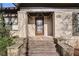 Close up view of a front entrance featuring brick columns, stone steps, and decorative lighting at 946 Highland Ne Vw, Atlanta, GA 30306